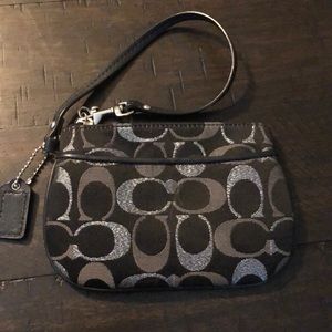 Black and silver coach wristlet